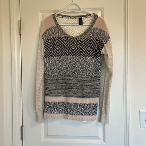 Buckle Crewneck Sweater.Embroidered back.Sleeves have a gold speckle throughout